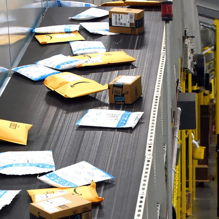 Amazon packages on a conveyer belt
