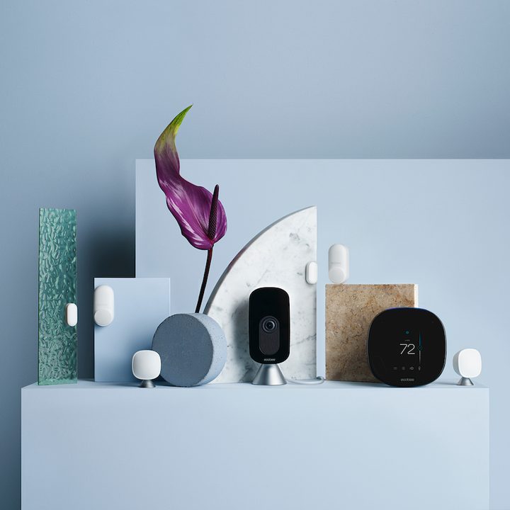 EcoBee SmartCamera on shelf with other smart home gadgets.