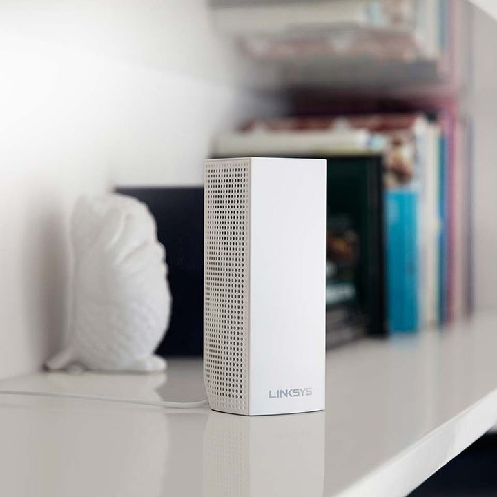 Linksys router on a shelf.