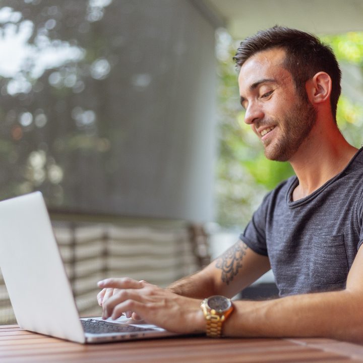 Stock photo of man using laptop