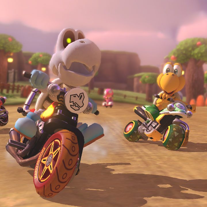 Dry Bones and Koopa compete in a Mario Kart race.