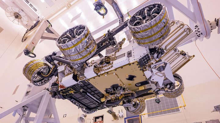 The Mars Helicopter, visible in lower center of the image, was attached to the belly of NASA's Perseverance rover at Kennedy Space Center on April 6, 2020.