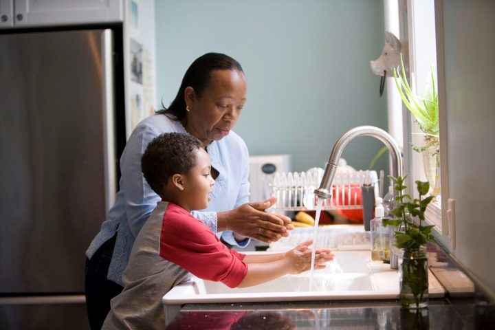 School-age child washing hands