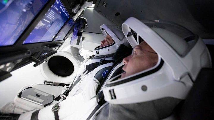 NASA astronauts Bob Behnken and Doug Hurley (front) participating in SpaceX's flight simulator.