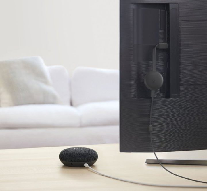 Google Nest Min next to a TV.