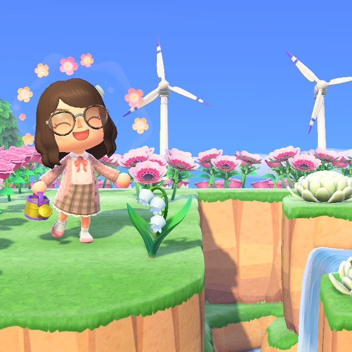 Player watering flowers in Animal Crossing: New Horizons.