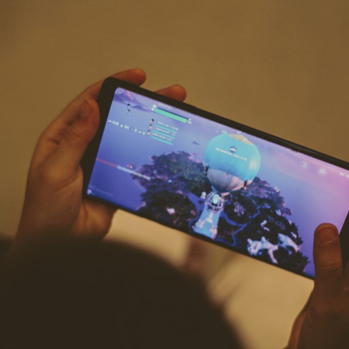 Someone playing Fortnite on a phone.