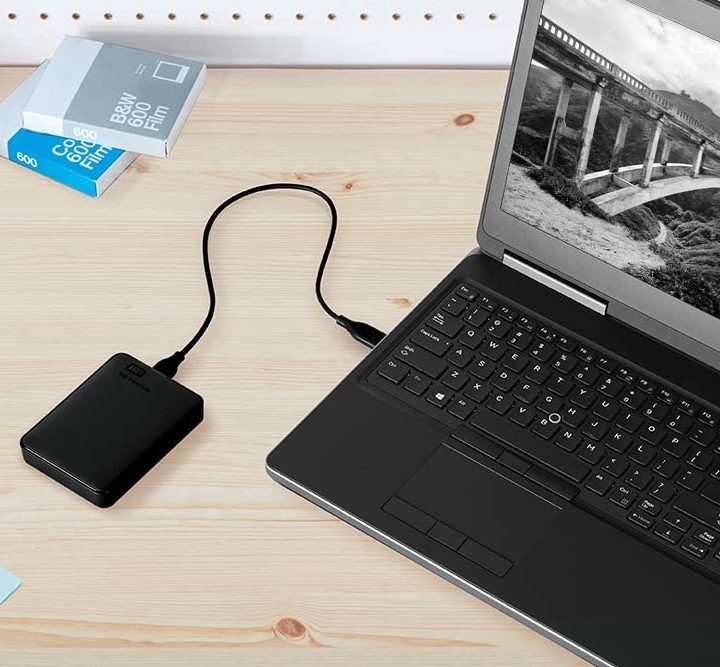 A laptop connected to an external drive.
