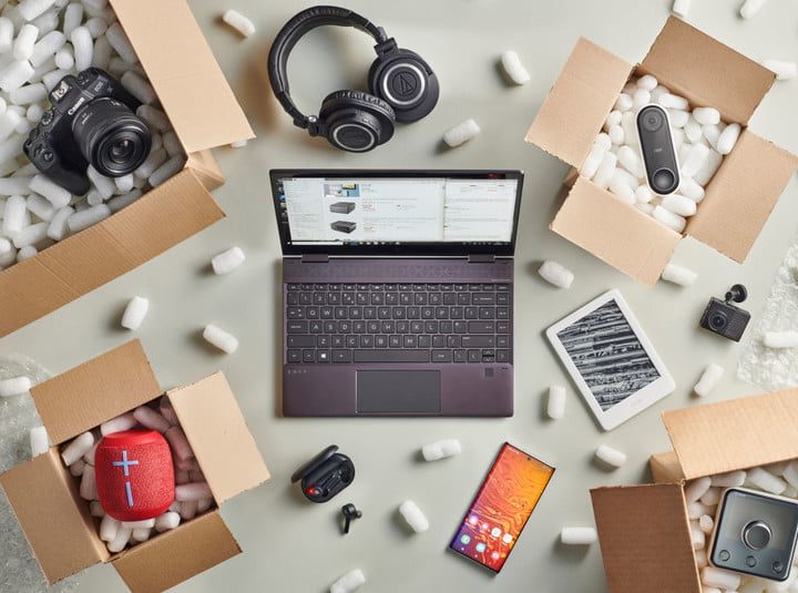 Open boxes revealing a range of tech purchases including a camera, tablet, smart speaker, laptop, headphones and more. 