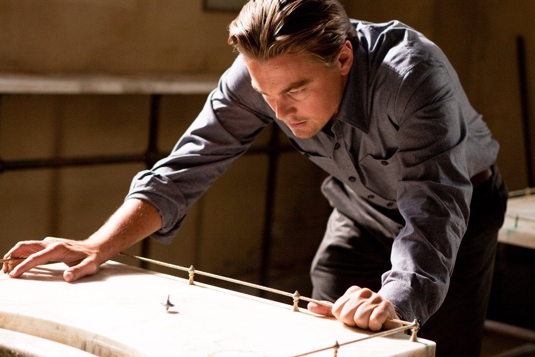 Leonardo DiCaprio looks at a spinning top in "Inception."