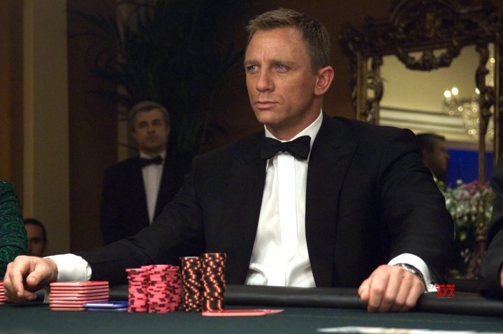 Daniel Craig sits at a poker table in Casino Royale.