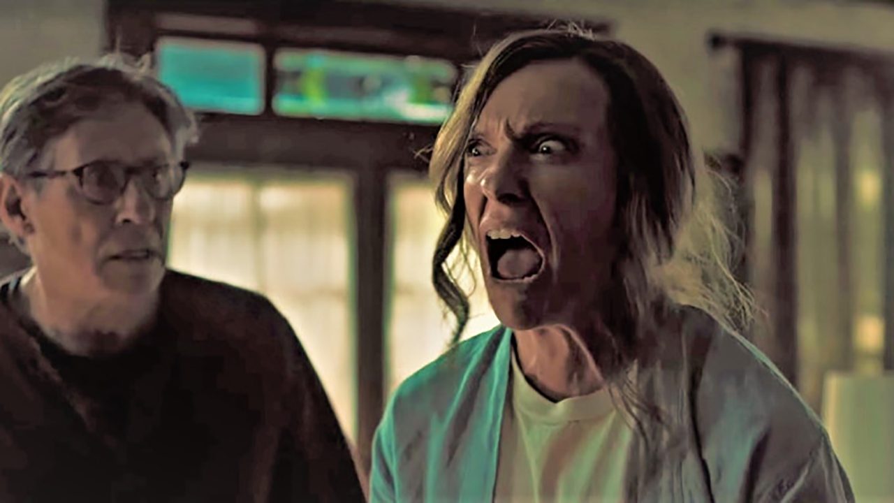 A woman screams while a man looks in shock.