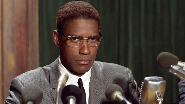 Denzel Washington speaks to a crowd as Malcolm X in "Malcolm X" (1992).