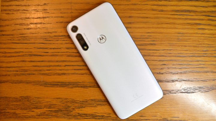 The Moto G Fast laying on a table.