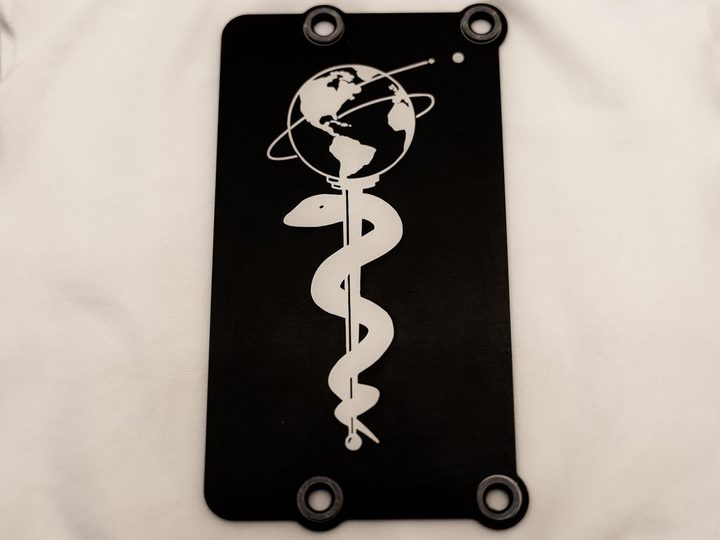 Attached to the Perseverance Mars rover, this 3-by-5-inch (8-by-13-centimeter) aluminum plate commemorates the impact of the COVID-19 pandemic and pays tribute to the perseverance of healthcare workers around the world.