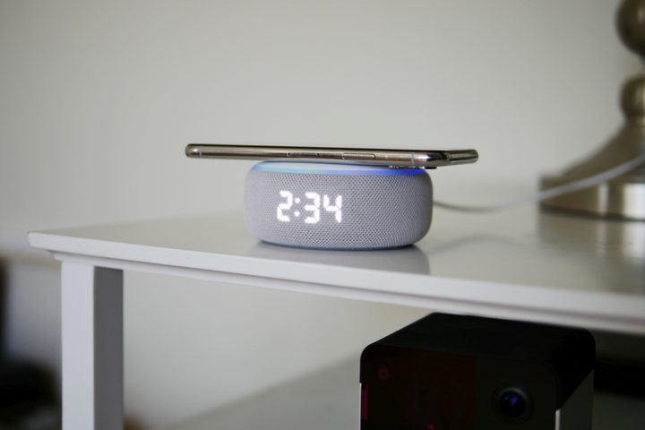 iPhone on top of Amazon Echo Dot with Clock