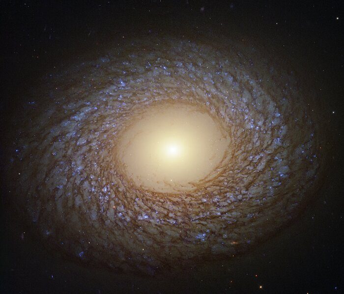 spiral pattern shown by the galaxy known as NGC 2775