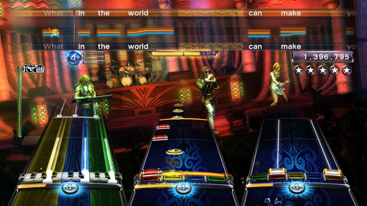 A band jams out in Rock Band 3.