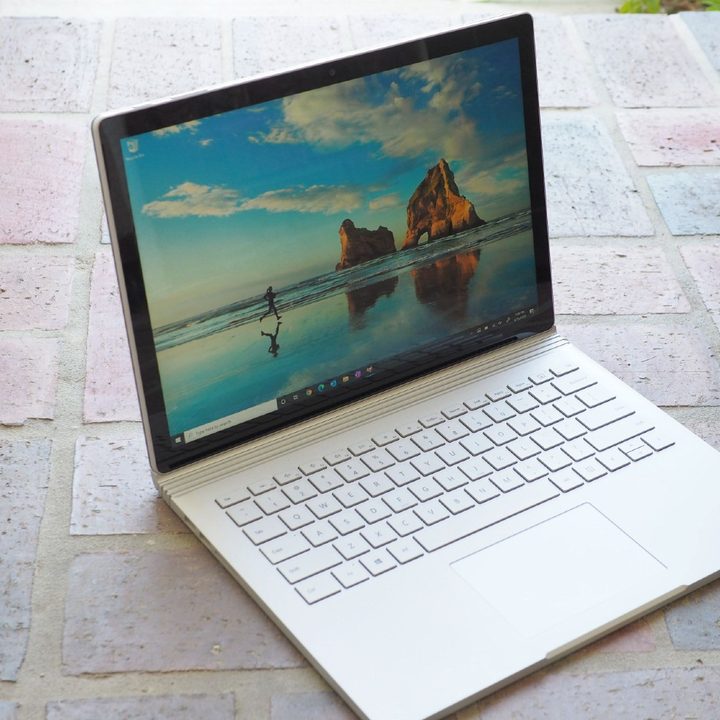 Surface Book 3 sitting on the floor with screen open.