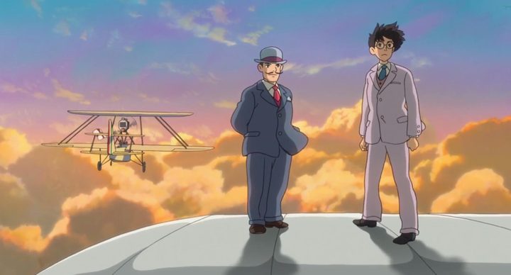 Two men on the wing of a plane in The Wind Rises.