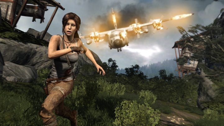 Lara Croft runs from a crashing plane in Tomb Raider.