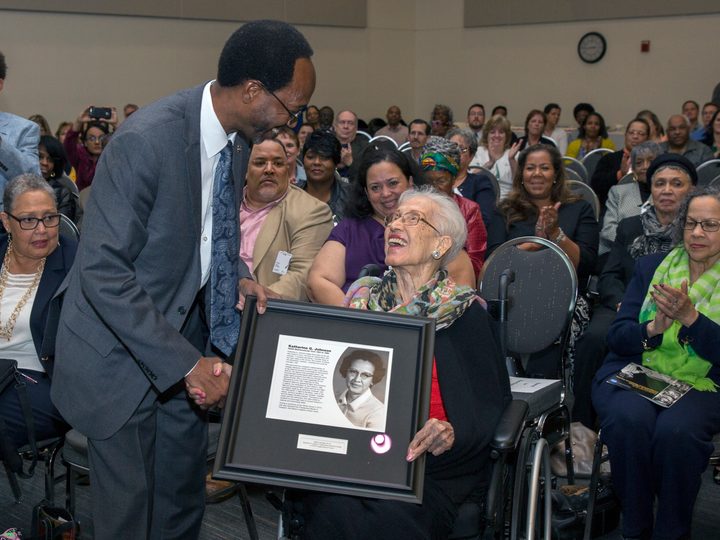 Clayton Turner presents Katherine Johnson with a plaque