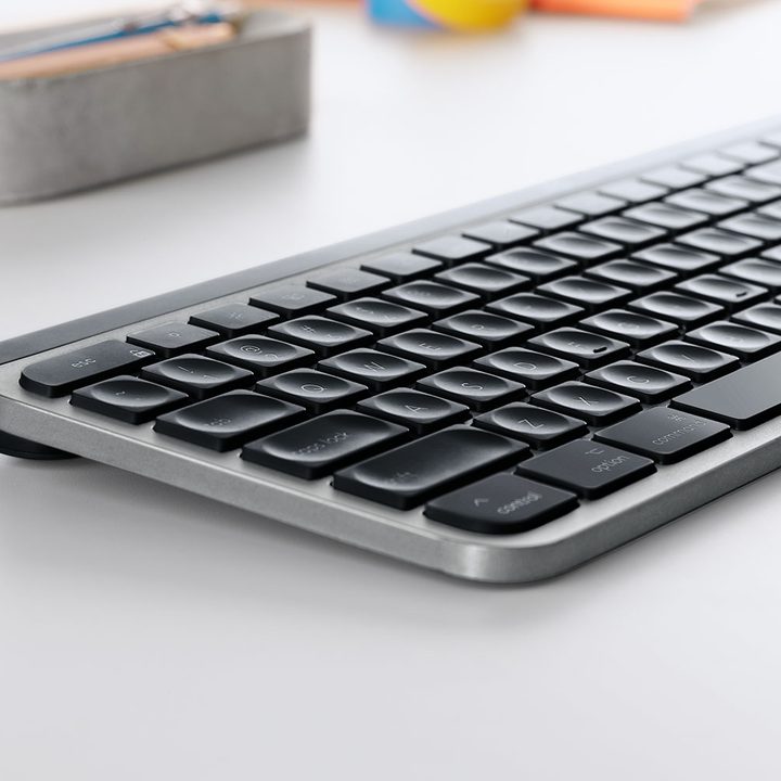 A close up of the Logitech MX Keys for Mac on a white desk.