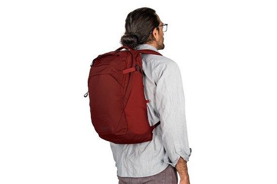 A person wearing an Osprey Apogee backpack.