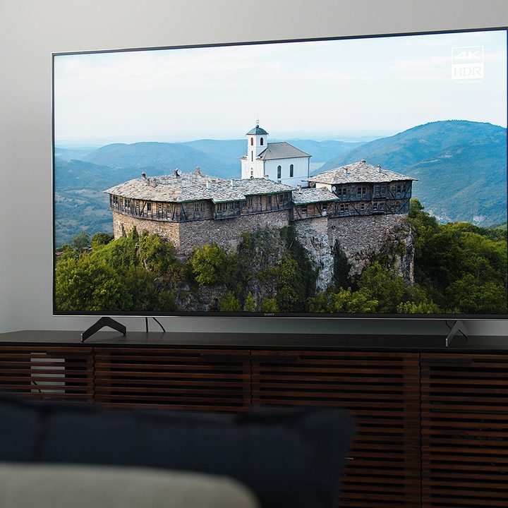 A mountaintop stone house viewed on a Sony X900H HDR TV.