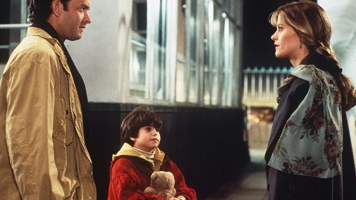 A father and a son talk to a woman in Sleepless in Seattle.