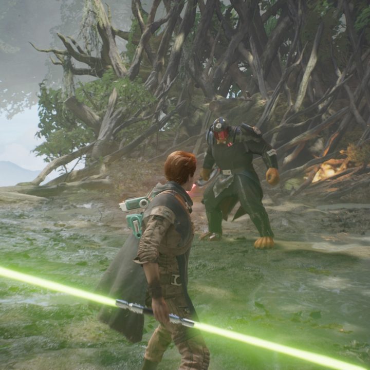 Cal holding a double-bladed lightsaber about to fight an enemy in Star Wars Jedi: Fallen Order..
