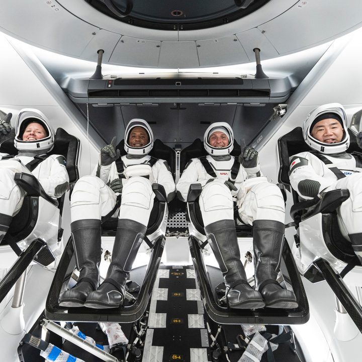 NASA&rsquo;s SpaceX Crew-1 crew members are seen seated in the company&rsquo;s Crew Dragon spacecraft during crew equipment interface training.