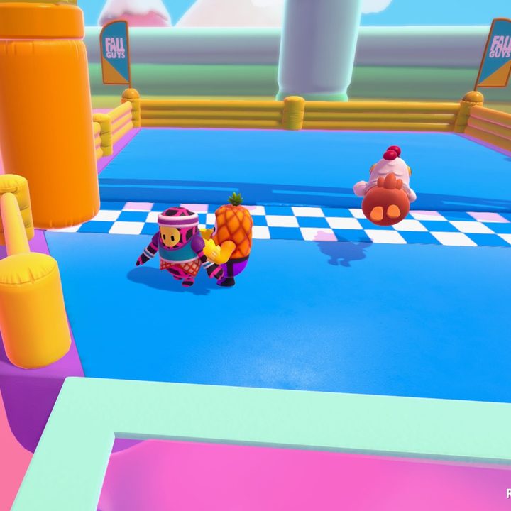 A pinapple character grabbing another player.
