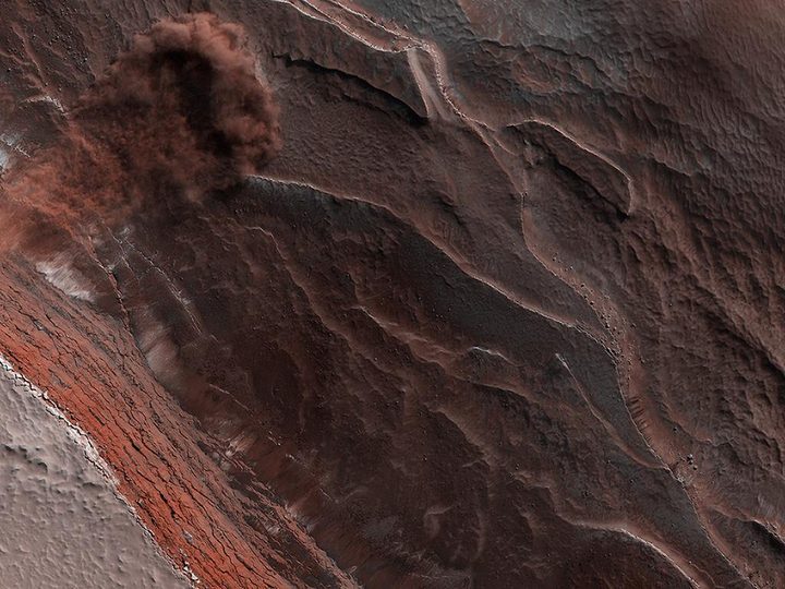 avalanche plunging down a 1,640-foot-tall (500-meter-tall) cliff on Mars