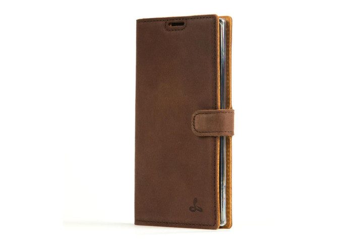 Photo shows a Samsung Galaxy Note 10 in a vintage chestnut brown leather wallet case from Snakehive