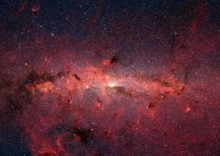 The center of our Milky Way galaxy captured by the Spitzer Space Telescope's infrared cameras.