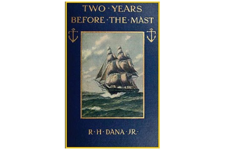 Picture shows the cover of the book in dark blue with gold writing, and a picture of a ship at sea in the center