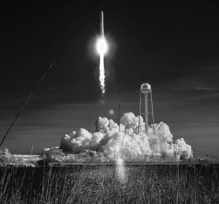The Northrop Grumman Antares rocket, with Cygnus resupply spacecraft onboard, is seen in this black and white infrared photograph as it launches from Pad-0A, Wednesday, April 17, 2019 at NASA's Wallops Flight Facility in Virginia.