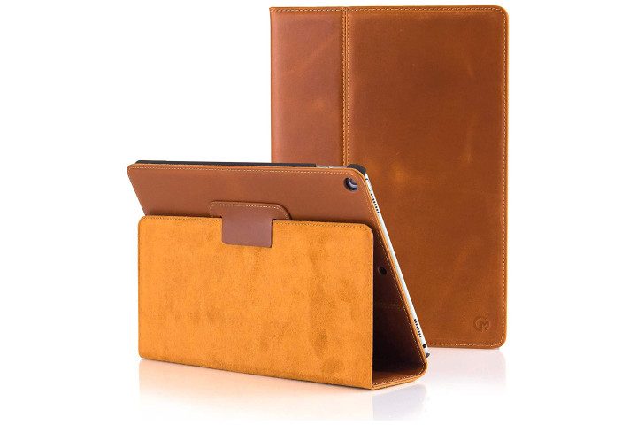 The iPad 2018 in a tan leather Casemade case, with a view of the front of the case and the back folded out into a kickstand.