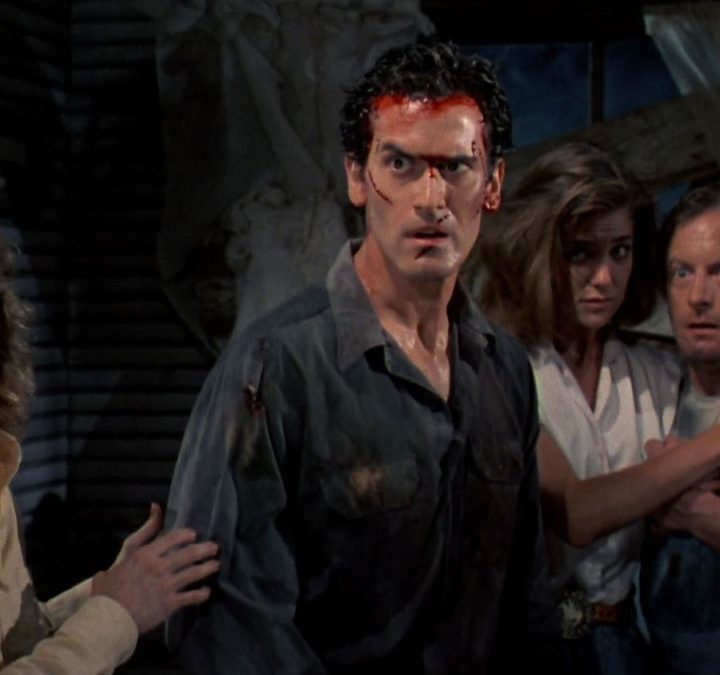 Ash looking bloodied in Evil Dead 2: Dead by Dawn