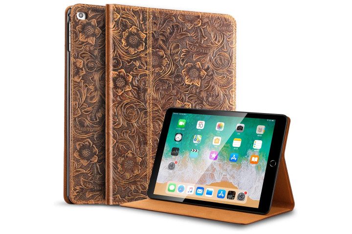 Brown leather folio case with carved floral design on an iPad, and the same case folded out into a kickstand.