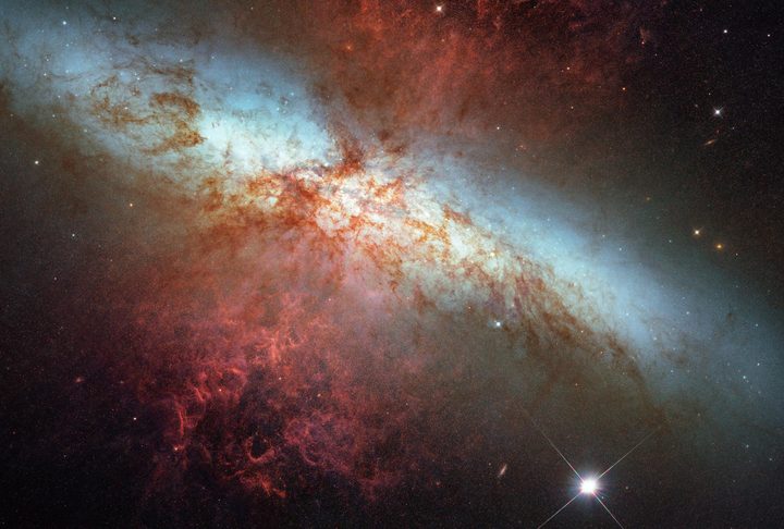 This is a Hubble Space Telescope composite image of a supernova explosion designated SN 2014J, a Type Ia supernova, in the galaxy M82.