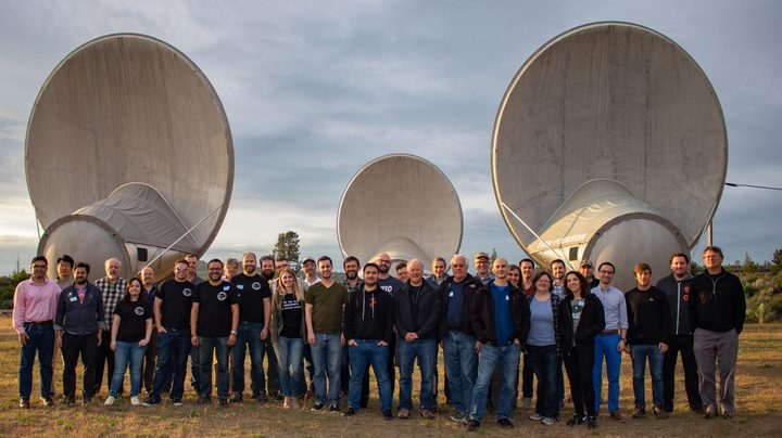 Hackathon group in front of ATA dishes