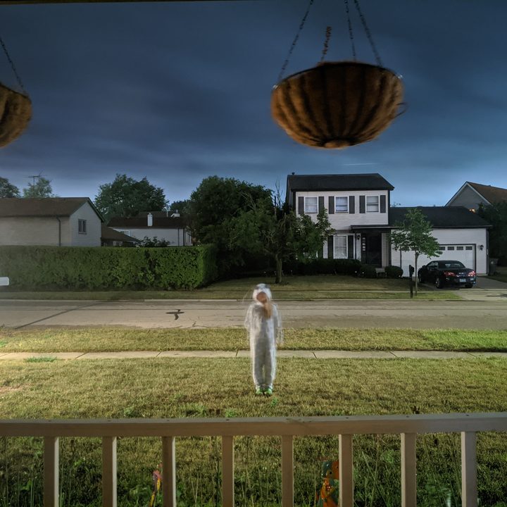Girl standing in front of my house in the dark - Photo taken iwth a Pixel 4a