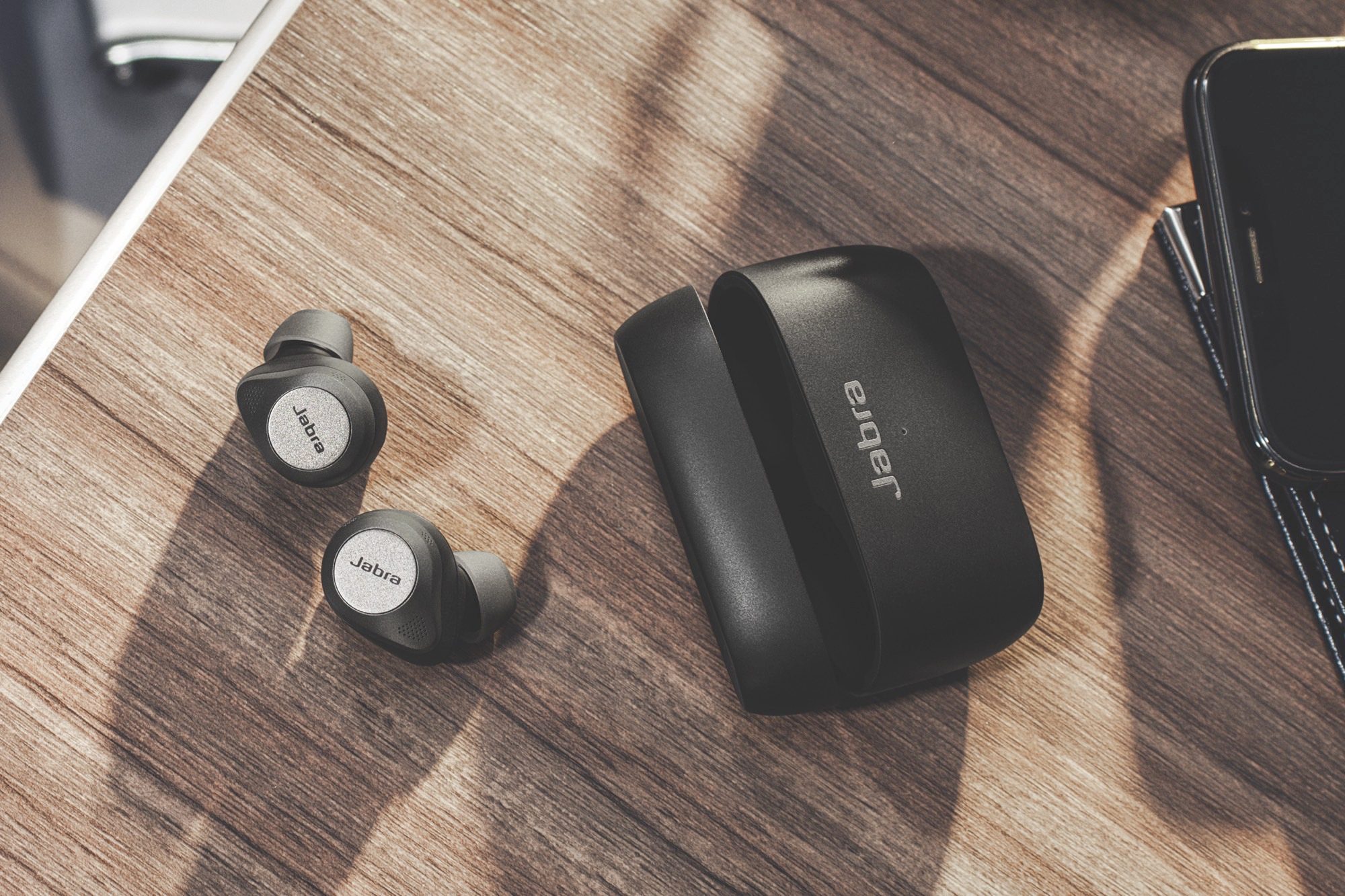 The Jabra Elite 85t wireless earbuds and their charging case.