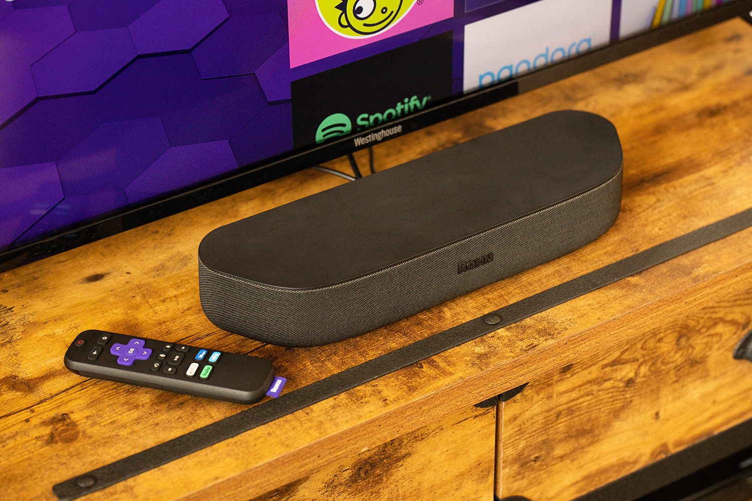 The Roku Streambar on a media console.