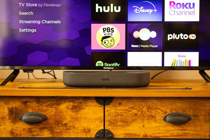Roku Streambar is shown beneath a TV.