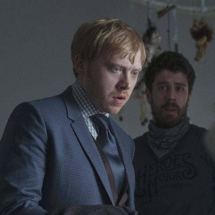 Rupert Grint looking into a crib, shocked in a scene from "Servant" on Apple TV+.