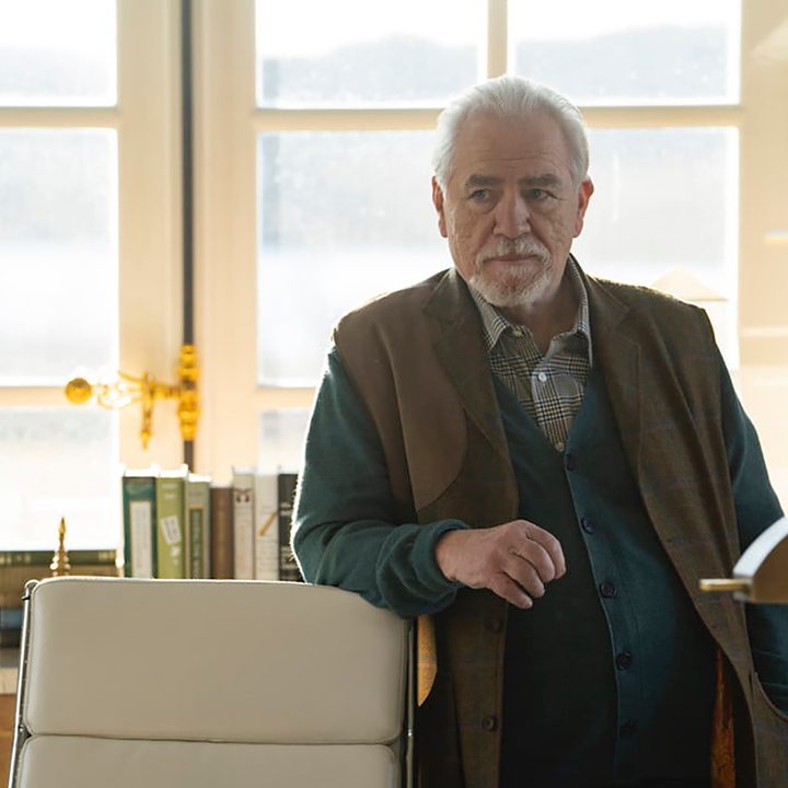 Logan Roy (Brian Cox) from Succession, leaning up against a chair.