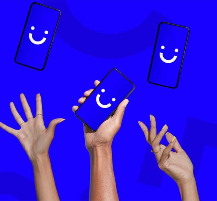 Three hands reaching upwards toward phones with the Visible smiley face logo displayed.